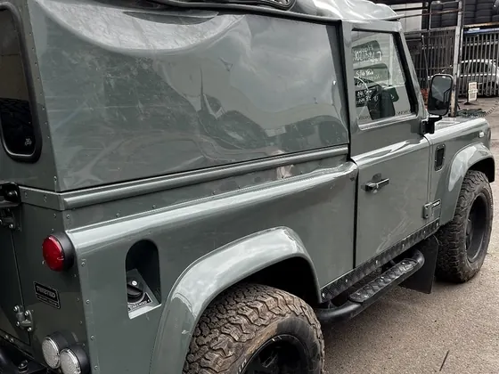 A Land Rover Defender in the workshop at GT Motors Centre, Tottenham